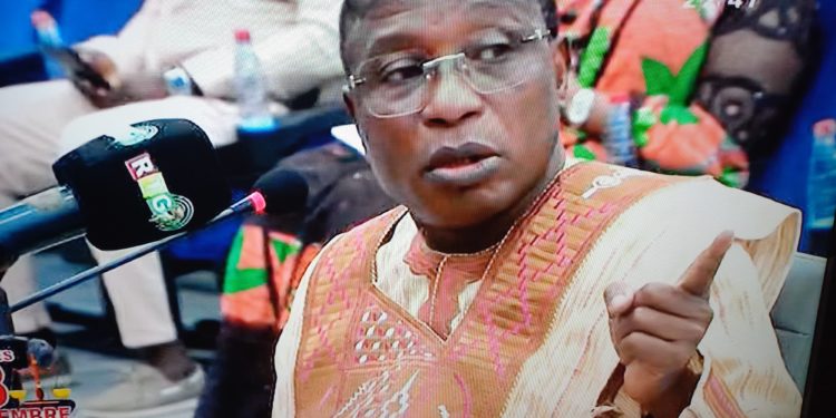 A screen grab of former Guinean military leader Moussa Dadis Camara testifying in his trial in Conakry. Photo credit, Kemo Cham, ManoReporters.