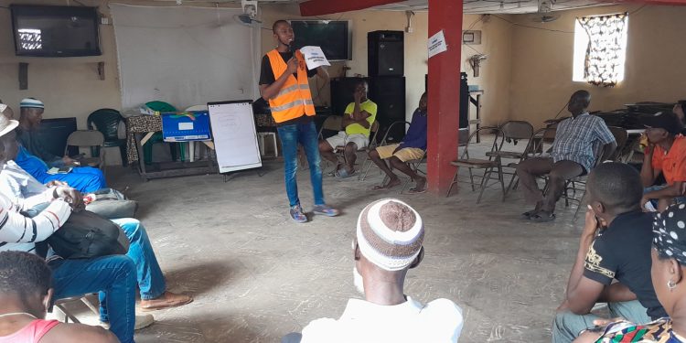 SWSL Coordinator Hassan Koroma facilitate a session during an engagement of community stakeholders in Susan's Bay in Thursday, February 23. Photo credit, Kemo Cham, ManoReporters