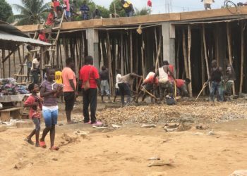A group of children with an average age of 13-years working at a construction site [Kailahun market] in the eastern Kailahun District of Sierra Leone. Photo credit, Stephen Lansana.