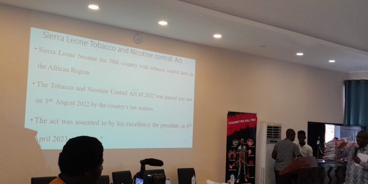 Dr Santigie Sesay, Director of Non-communicable Diseases and Mental Health, make a presentation on Sierra Leone's tobacco Act as part of commemoration of World No Tobacco Day on May 31st, 2023. Dr Sesay said work on a draft regulations needed to operationalize the law is in progress. Photo credit, Kemo Cham, ManoReporters.