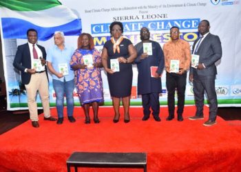 Action Aid International Sierra Leone Executive Director, Foday Bassie Swaray, 3rd from right, pose with other officials with copies of the Citizens Climate Change Manifesto, June 12, 2023. Photo Credit, SCCA.