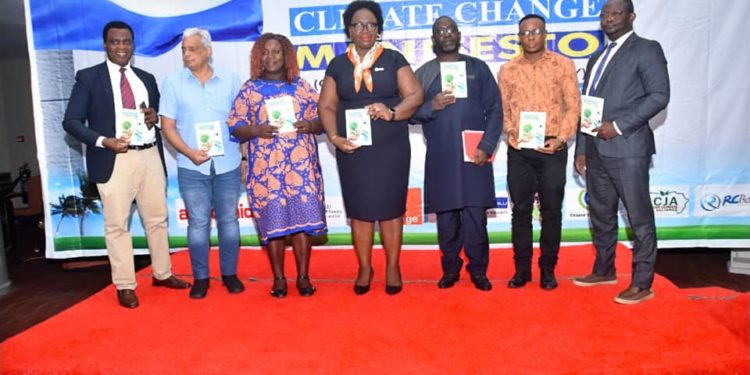 Action Aid International Sierra Leone Executive Director, Foday Bassie Swaray, 3rd from right, pose with other officials with copies of the Citizens Climate Change Manifesto, June 12, 2023. Photo Credit, SCCA.