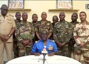 Niger army spokesman Colonel-Major Amadou Abdramane speaks during an appearance on national television, after President Mohamed Bazoum was held in the presidential palace in Niamey, Niger, July 26, 2023 [ORTN via Reuters TV]