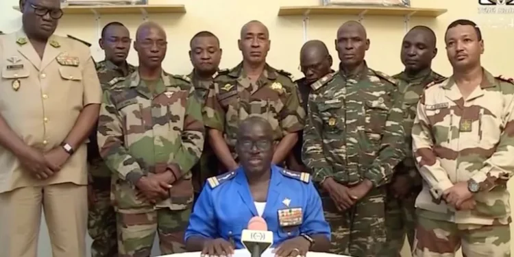 Niger army spokesman Colonel-Major Amadou Abdramane speaks during an appearance on national television, after President Mohamed Bazoum was held in the presidential palace in Niamey, Niger, July 26, 2023 [ORTN via Reuters TV]