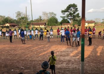 Youths playing football in Kingtom, Freetown. Photo credit: Emma Black