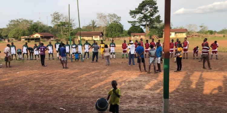 Youths playing football in Kingtom, Freetown. Photo credit: Emma Black