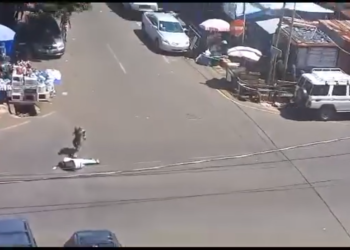 A screengrab from an amateur video shows the military officer standing over the motionless body of the gunman, shortly after dropping him down. Photo credit, Kemo Cham, ManoReporters
