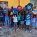 Kids who benefitted from SWSL's back-to-school package display their goodies. Photo credit, Hassan Koroma, ManoReporters