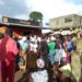 People queue up at an Orange Mobile Money outlet in Pujehun Town, waiting to be paid as part of the Emergency Cash Transfer programme by the government of Sierra Leone. Phot credit, Brima Sannoh, ManoReporters.
