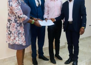 Minister of Social Welfare, Melrose Karminty, hands over an assessment report on child trafficking. Photo credit, Ministry of Social Welfare.