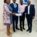 Minister of Social Welfare, Melrose Karminty, hands over an assessment report on child trafficking. Photo credit, Ministry of Social Welfare.