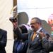 WHO Director-General Dr. Tedros Adhanom Ghebreyesus displays his award as Zambian President Hakainde Hitchilema claps