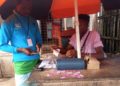 A customer makes mobile money transfer in the town of Sahn Malenin Pujehun District, Eastern Sierra Leone. Photo Credit Brima Sannoh ManoReporters.