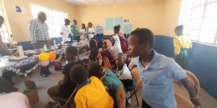 School children attend a presentation in the biology station at the 6th edition of the National Science Festival in 2023 in Kabala, Koinadugu District. Photo credit, Kemo Cham, ManoReporters.