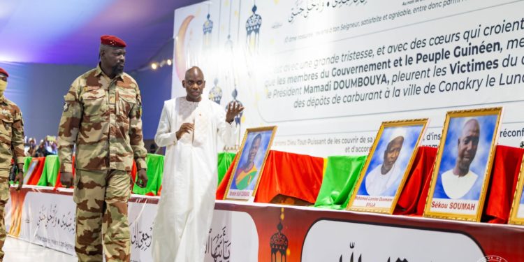 Guinea's junta leader General Army Commanda Mamadi Doumbouya on Friday, 2 February, 2024, pays his respect to victims of the December 18 oil depot explosion in Conakry. Photo credit, Presidency of Guinea.