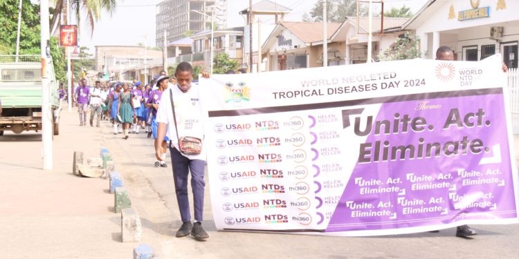 School pupils march along a highway in Freetown as part of commemoration of World Neglected Tropical Diseases in Sierra Leone on January 30th, 2024. Photo credit, Ibrahim Barrie, ManoReporters