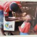 A Health worker vccinates a child with polio vaccine. Photo credit, WHO Sierra Leone