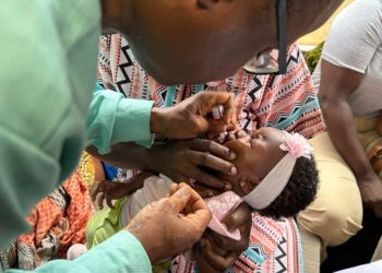 Deputy Minister of Health 1, Charles Senesie, administers the vaccine on a child at the official launching ceremony on Friday, May 10, 2024.