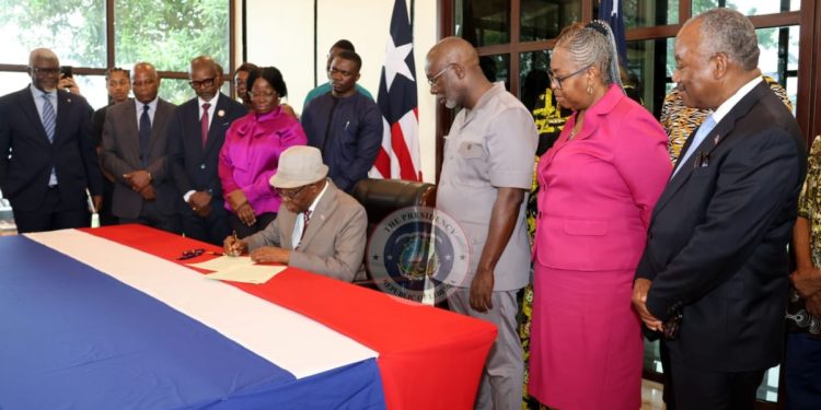 President Boakai signs Executive Order 131, paving war for the creation of war and economic crimes court. Photo credit, Executive Mansion.