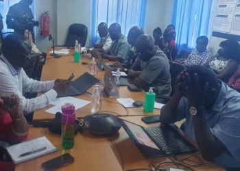 Officials speak to the press in a conference room of the EOC. Photo credit, Morrie Koroma, ManoReporters