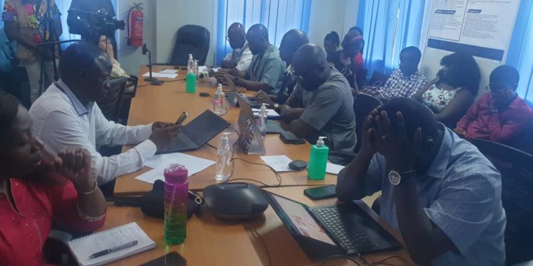 Officials speak to the press in a conference room of the EOC. Photo credit, Morrie Koroma, ManoReporters