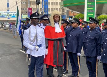 Acting Chief Justice of Sierra Leone, Nicholas C. Browne-Marke, inspects a guard of honor mounted by the personnel of the Sierra Leone police as part of the ceremony marking the beginning of the September session of Criminal cases. Image, Judiciary Communications Unit, Judiciary of Sierra Leone.