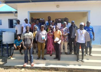 Officials from Sierra Leone and Guinea pose for a photo after meeting at the border town of Koindukura on August 22, 2024. The meeting was organized by the NGO, FOCUS 1000 to foster cross border collaborations. Image, Steven Gibrilla, Mamaye.