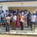 Officials from Sierra Leone and Guinea pose for a photo after meeting at the border town of Koindukura on August 22, 2024. The meeting was organized by the NGO, FOCUS 1000 to foster cross border collaborations. Image, Steven Gibrilla, Mamaye.