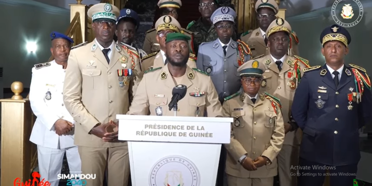 Guinean junta spokesman, Major General Amara Camara, flanked by fellow decorated officers, rejected as “rumors” suggestions that the country is harboring foreign troops. Image, screengrab of video from Presidency of Guinea.