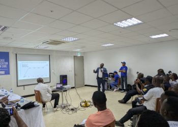 A local consultant presents findings of a report analysing health financing in Sierra Leone. Image, Kemo Cham, ManoReporters