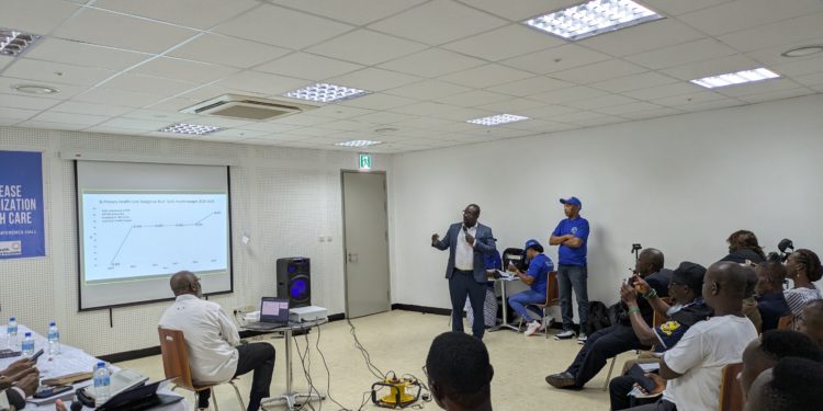 A local consultant presents findings of a report analysing health financing in Sierra Leone. Image, Kemo Cham, ManoReporters