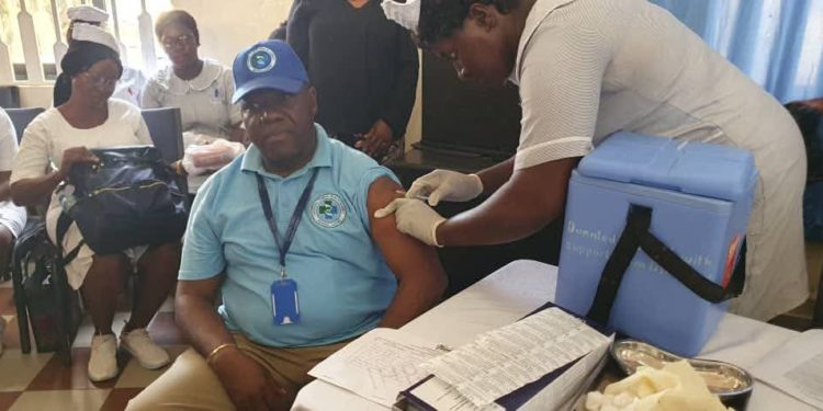 National Public Health Agency Executive Director Prof. Foday Sahr is among the first people to get a shot of the vaccine. Image, NPHA