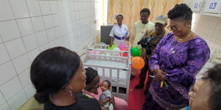 Minister of Gender and Children's Affairs of Sierra Leone, Dr Isata Mahoi, talks to a lactating nurse in the first workplace lactation room in Sierra Leone on Friday, August 1st, 2025. Image, Kemo Cham, ManoReporters.