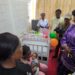 Minister of Gender and Children's Affairs of Sierra Leone, Dr Isata Mahoi, talks to a lactating nurse in the first workplace lactation room in Sierra Leone on Friday, August 1st, 2025. Image, Kemo Cham, ManoReporters.