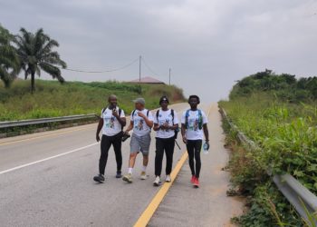 Members of Fathers for Life Club walking in the bush somewhere in Kailahun District on December 15, 2025. Image, Kemo Cham.