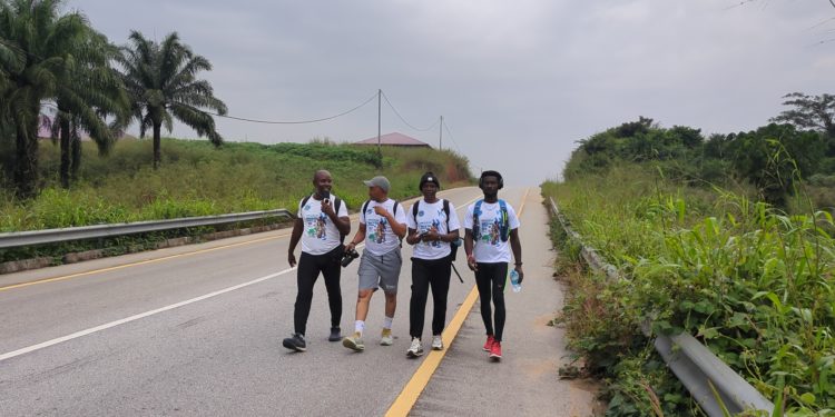 Members of Fathers for Life Club walking in the bush somewhere in Kailahun District on December 15, 2025. Image, Kemo Cham.