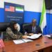 Sierra Leone's Minister of Health Dr Austin Demby exchanges signed copies of the agreement with the US Charge 'dAffairs during the signing ceremony at an in Freetown. Image, MoH Sierra Leone.