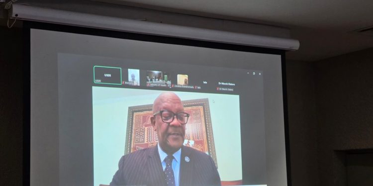 The Minister of Health, Dr. Austin Demby, addressing delegates in a press conference through an online link from Washington D.C. Image, MOH Communications.