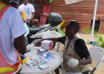 An SLYCL volunteer attends to a person with person with substance abuse during a sepcial occasion commemorating the International Day to End Drug Trafficking. Image, Kemo Cham, ManoReporters.