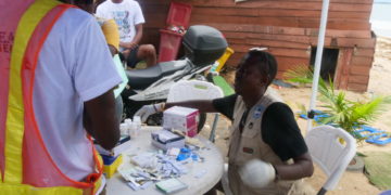 An SLYCL volunteer attends to a person with person with substance abuse during a sepcial occasion commemorating the International Day to End Drug Trafficking. Image, Kemo Cham, ManoReporters.