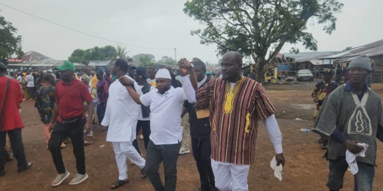 Paramount Chief Elect Maada Joe Kpunyeh Kebbie walk with former rivals Amadu Paul Sengeh (in white dressing) and AMidu Kebbie (in brown and white dressing), after they endorsed him for the run-off on Sunday 14th June, 2026. Image/Brima Sannoh, ManoReporters.
