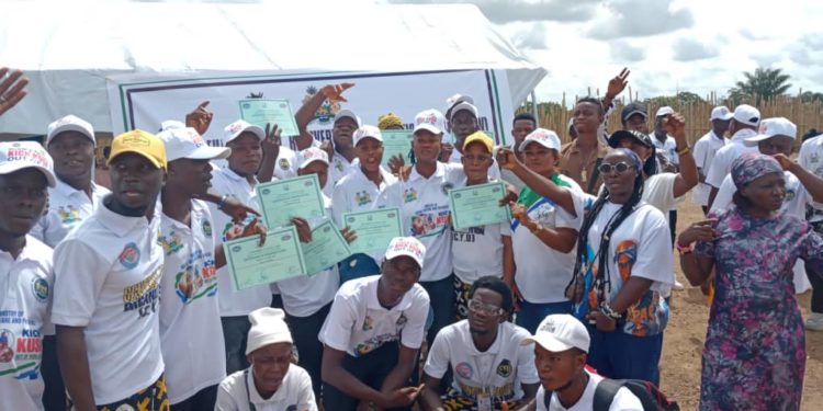 newly graduated men and women from a drug rehabilitation center in Kono ose with their certificates alongwise family members on June 5th, 2026. Image, NPHA Sierra Leone.